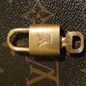 Authentic Louis Vuitton brass lock and key set #316